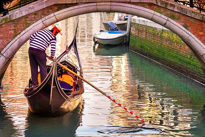 Explore the Canals on an Authentic Gondola Tour Venetian Dreams - Shared boat, assigned seats, and boarding help