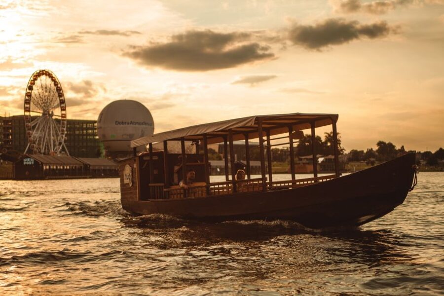 Krakow: Vistula Night Cruise by Gondola w/ Audio Commentary - Boarding the wooden gondola in Kazimierz