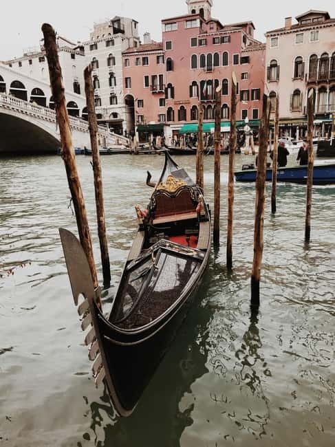 Venice: Gondola Ride under the Bridge of Sighs and Premium Audio Guide - Boarding a shared Venetian gondola