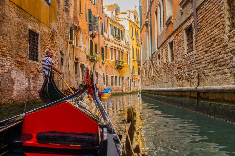 Venice: Private Gondola Tour - Boarding a private gondola for a classic Venetian view
