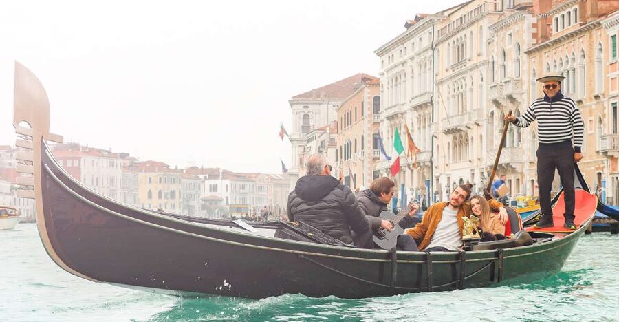 Venice: Shared Gondola Ride and Serenade - Boarding a shared boat with up to six people